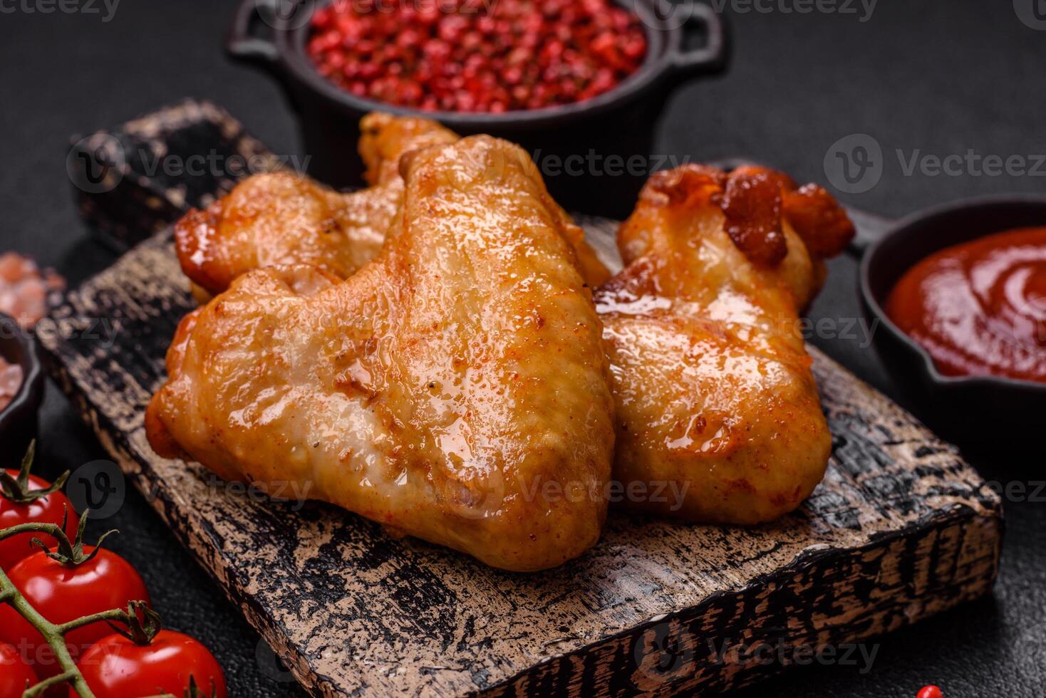 Delicious fried chicken wings with salt, spices and herbs photo