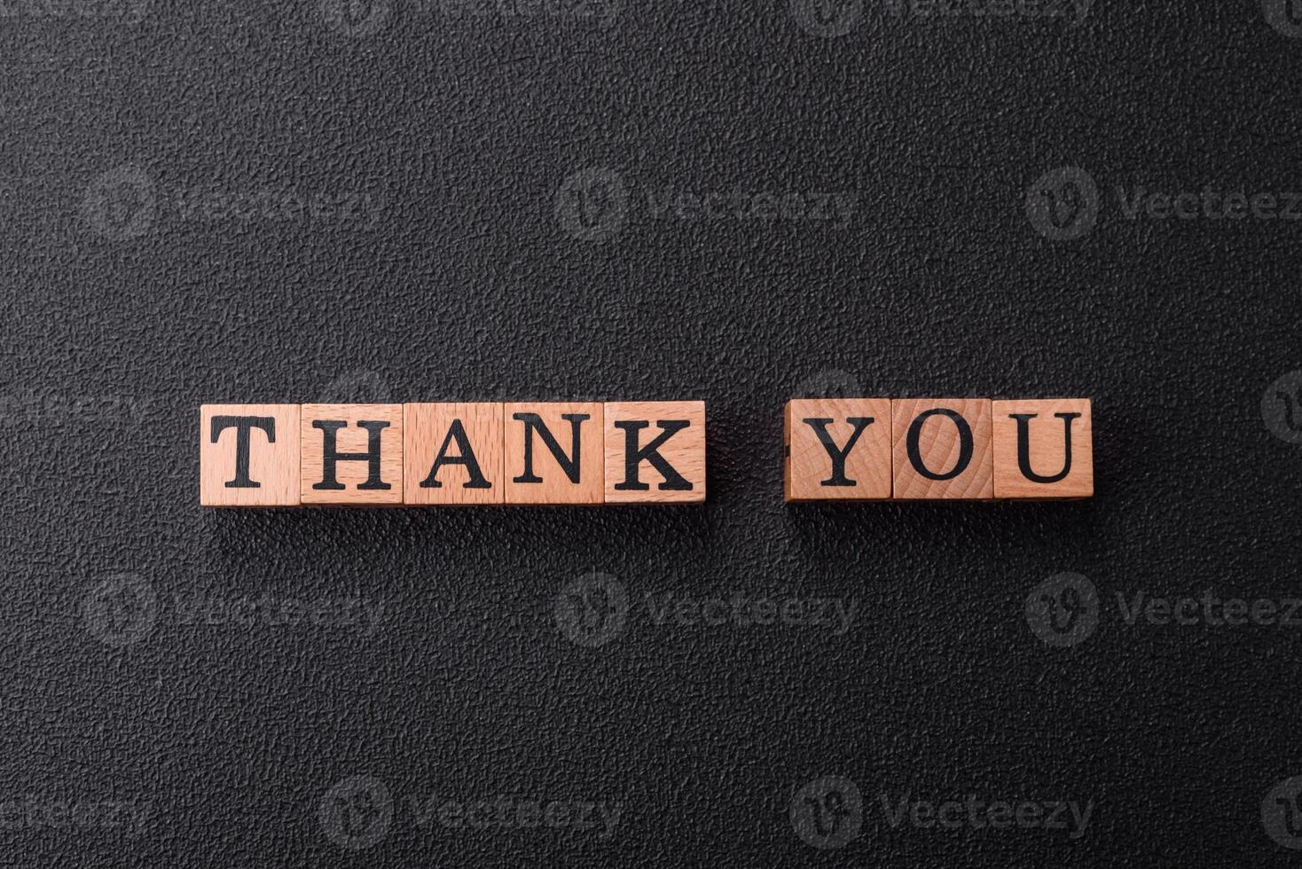 Inscription Thank you with wooden cubes, conceptual background with copy space photo