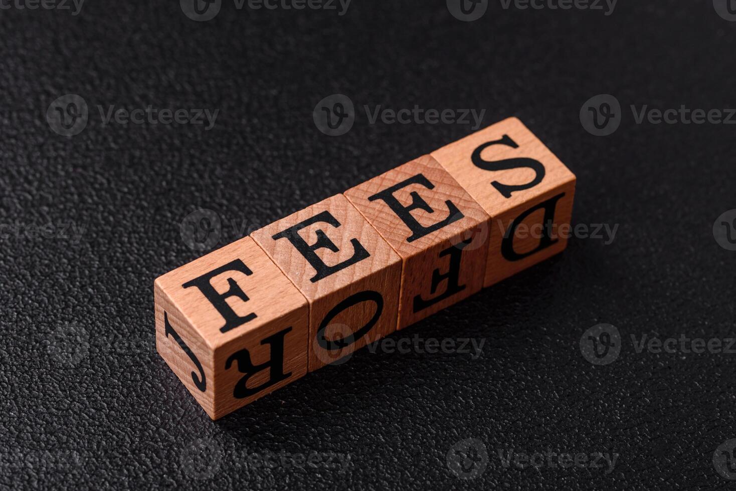 Inscription Fees with wooden cubes, conceptual background with copy space photo
