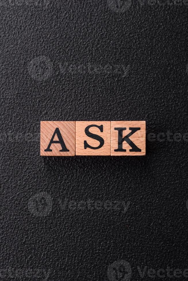 Inscription ASK wooden cubes, concept background with copy space photo
