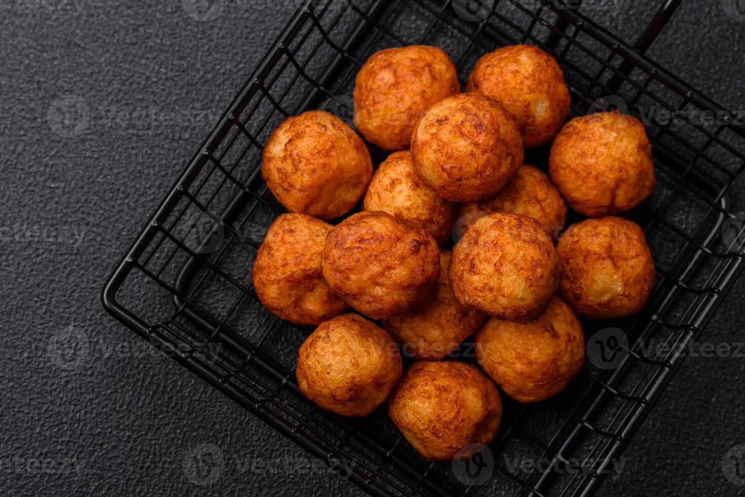 Delicious crispy balls breaded with mozzarella cheese, salt and spices photo
