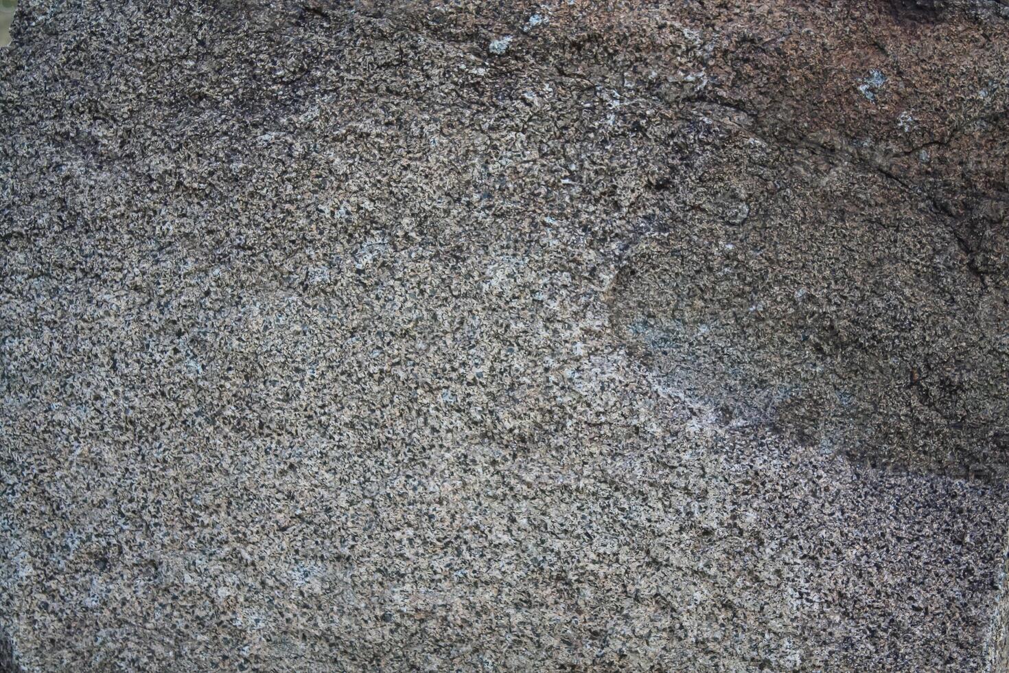 Rough, grey, dark harsh and high contrast granite stone texture background. A close-up of the surface of abstract natural rock. Natural Marble stone wallpaper. photo