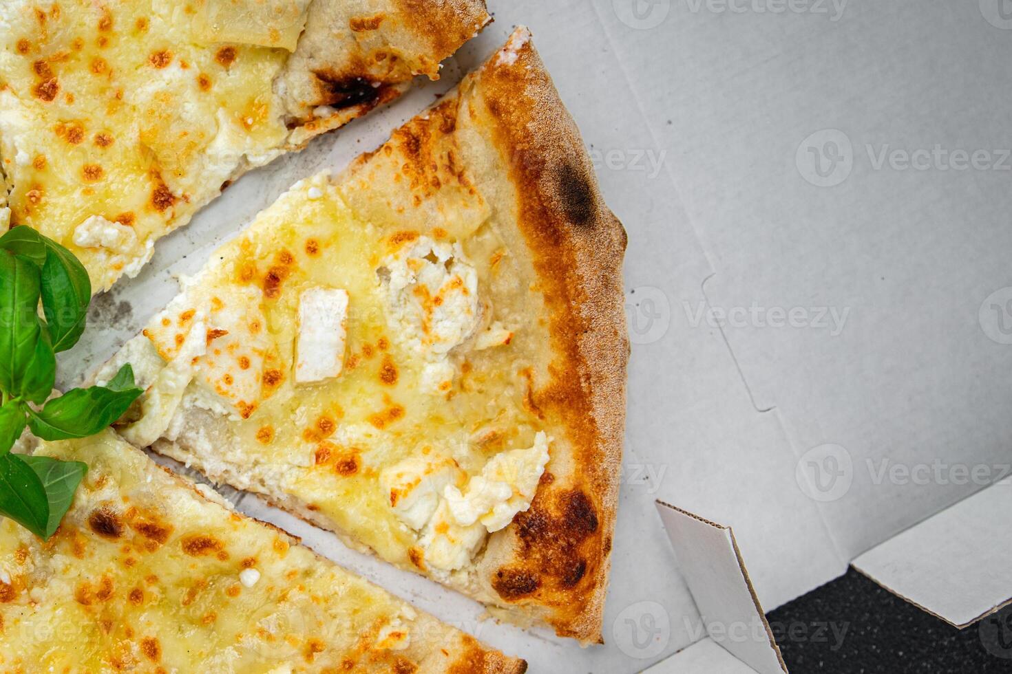 pizza four types of cheese mozzarella, blue cheese, camembert and cheddar fresh meal food snack on the table copy space food background rustic top view photo