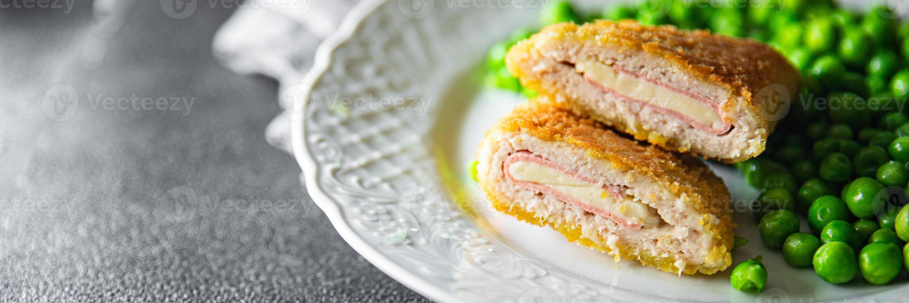 cutlet cordon bleu chicken meat, cheese, bacon meal snack on the table copy space food background rustic top view photo