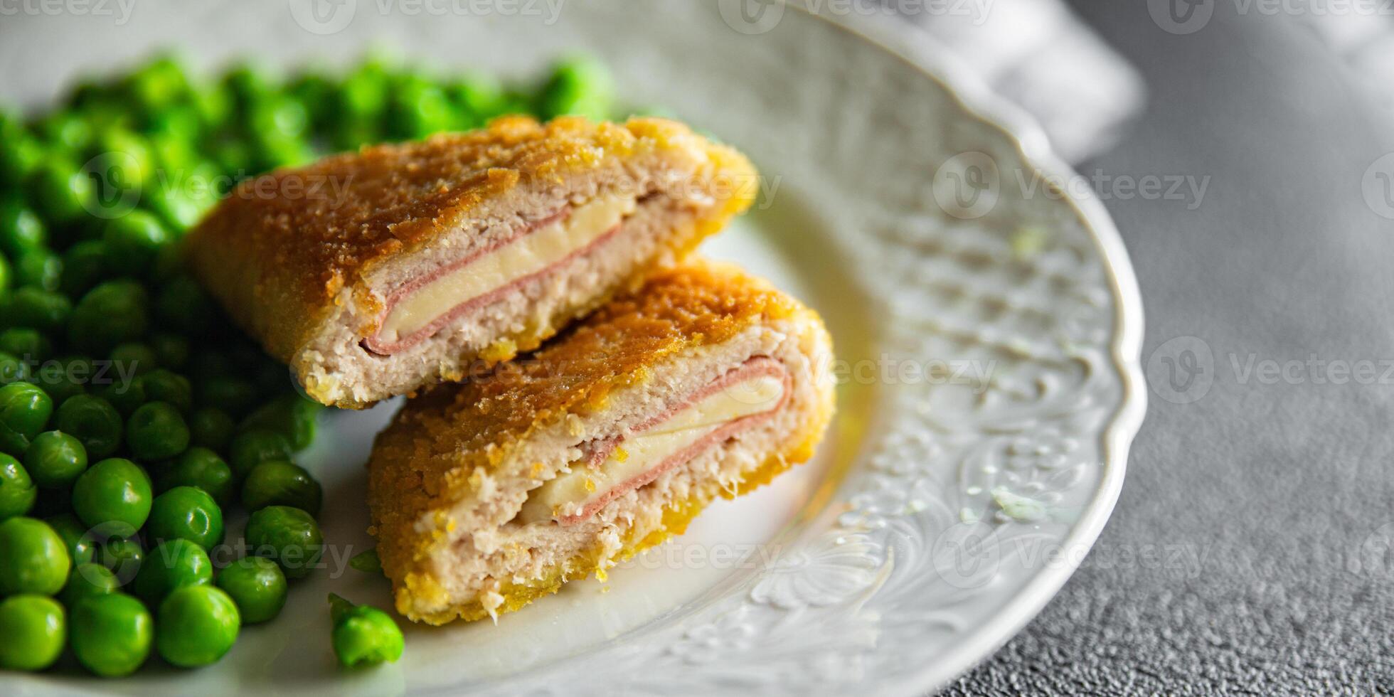 cutlet cordon bleu chicken meat, cheese, bacon meal snack on the table copy space food background rustic top view photo