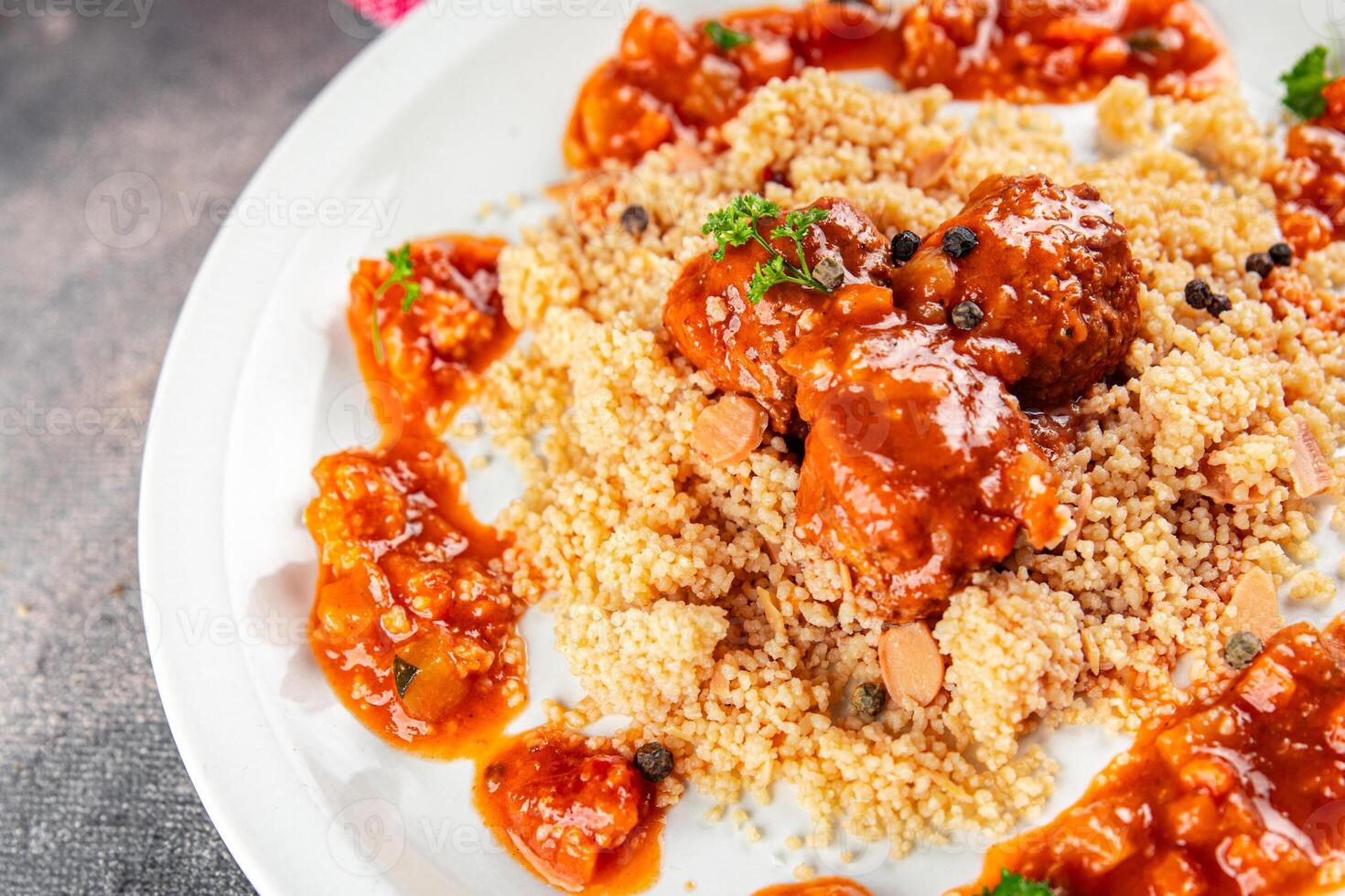 couscous with meat balls vegetable sauce tasty fresh meal food snack on the table copy space food background rustic top view keto or paleo diet photo