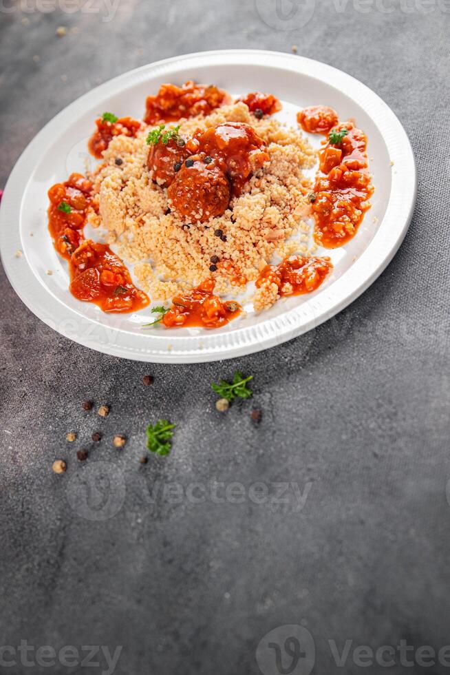 couscous with meat balls vegetable sauce tasty fresh meal food snack on the table copy space food background rustic top view keto or paleo diet photo