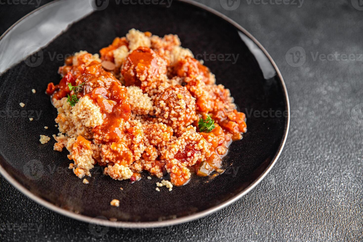 couscous with meat balls vegetable sauce tasty fresh meal food snack on the table copy space food background rustic top view keto or paleo diet photo