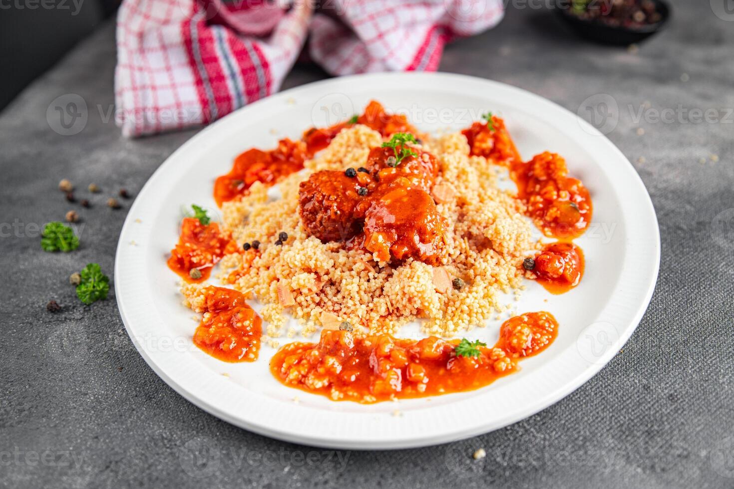 couscous with meat balls vegetable sauce tasty fresh meal food snack on the table copy space food background rustic top view keto or paleo diet photo