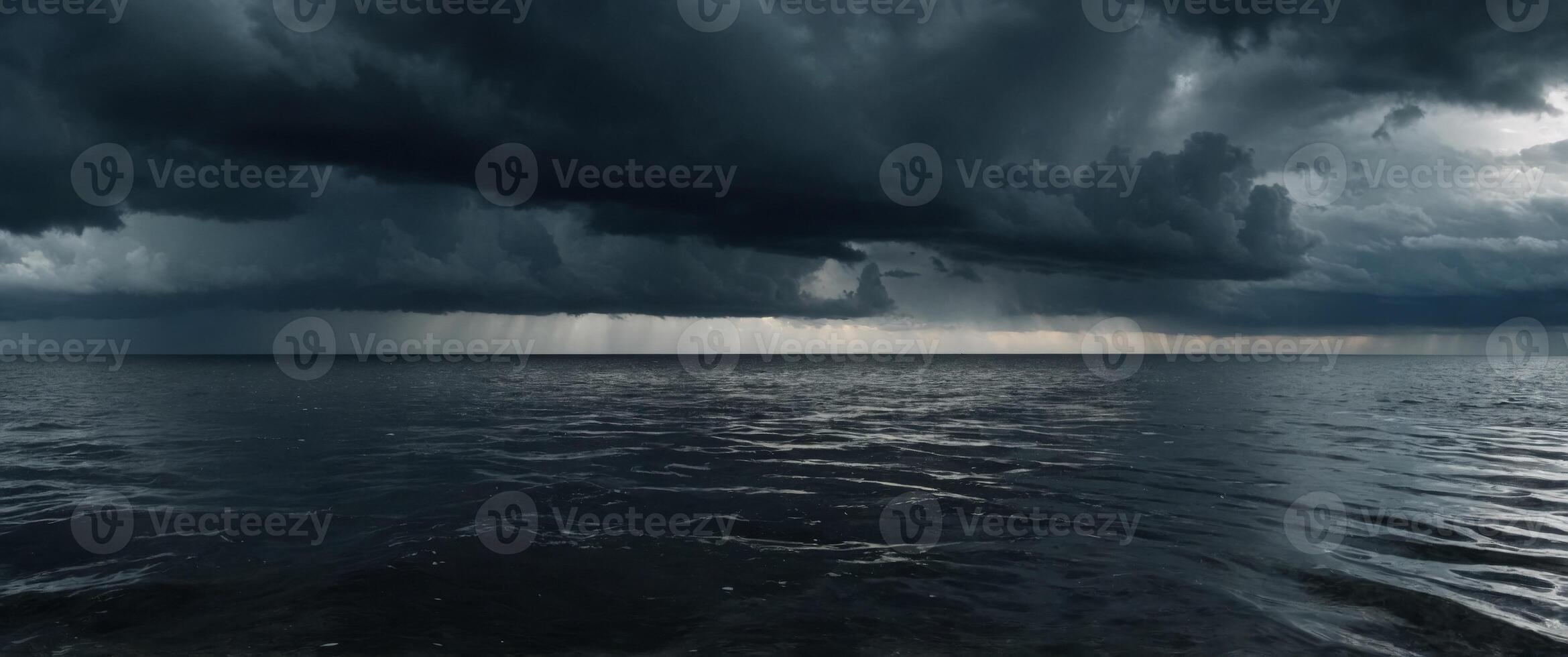 Seething sea Dramatic black and gray stormy cloudy sky reflecting on the troubled water surface Panoramic wide angle view Fantasy stormy sea. photo
