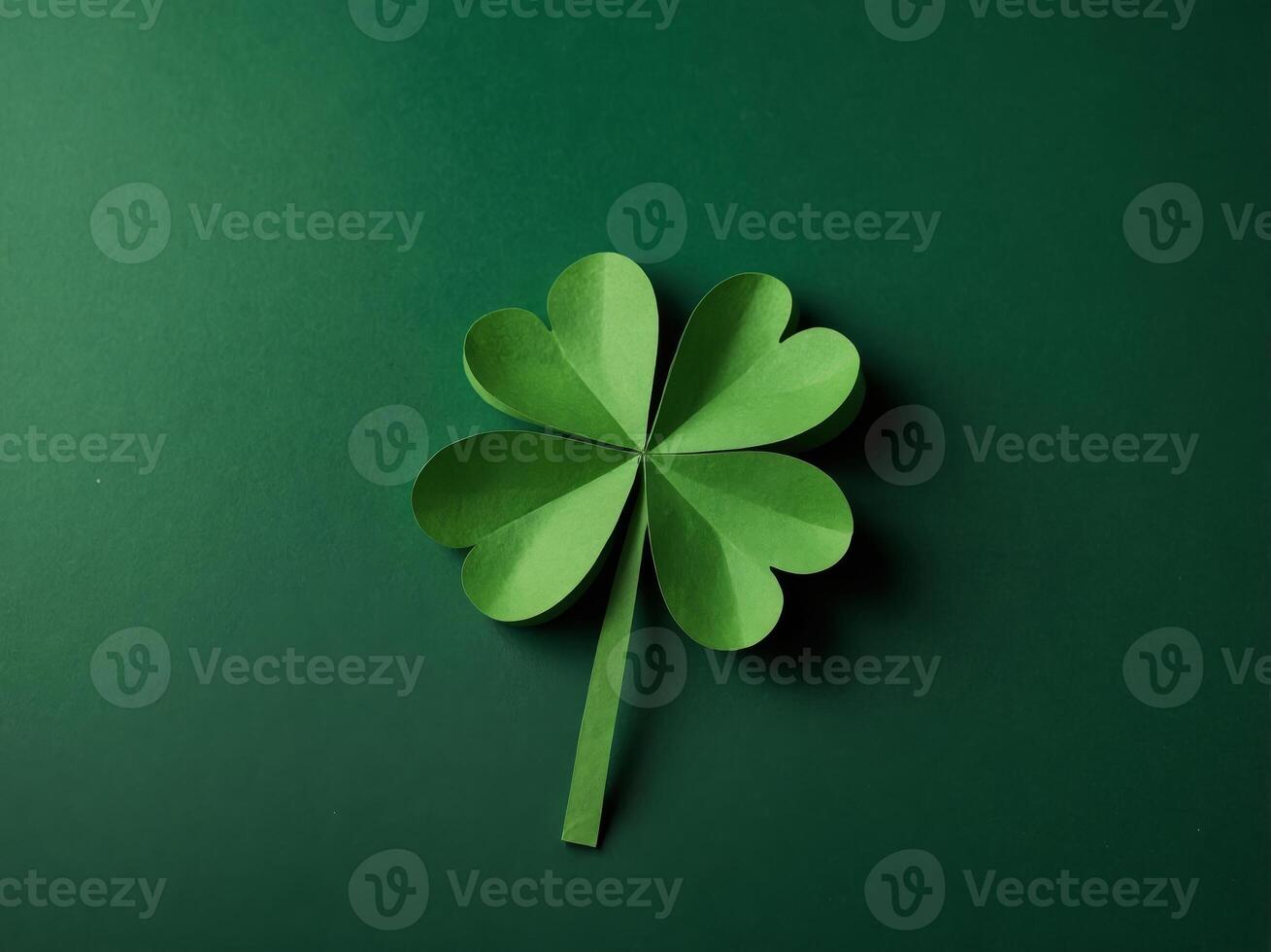 St Patrick Day concept Paper art and craft style four-leaf clover on green background Flat lay, top view, vertical. photo
