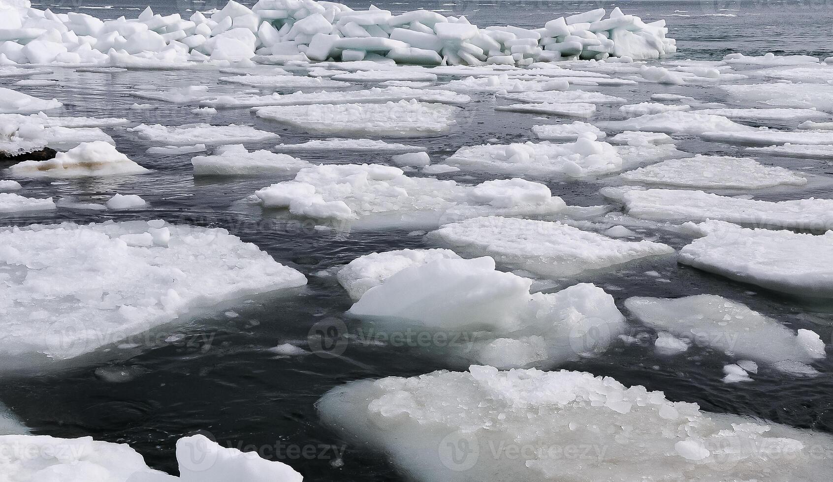 The Black Sea near Odessa is frozen. Ice floes float on the shore photo