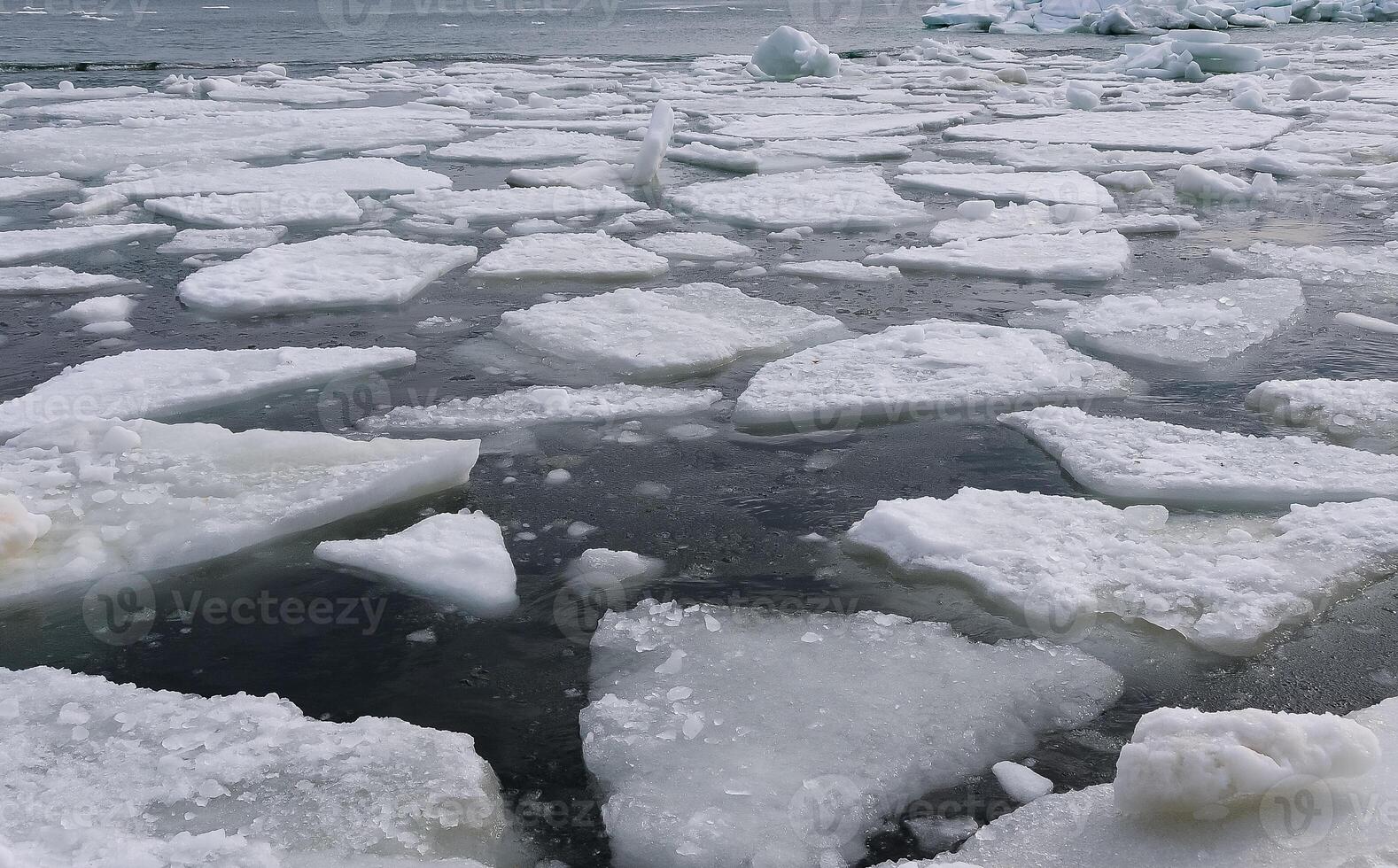 The Black Sea near Odessa is frozen. Ice floes float on the shore photo