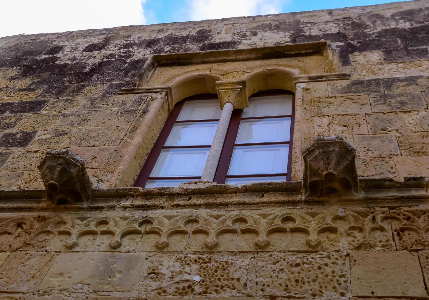 GOZO, MALTA - SEPTEMBER 14, 2012 decorative elements and windows in the citadel of the fortress on the island of Gozo, Malta photo