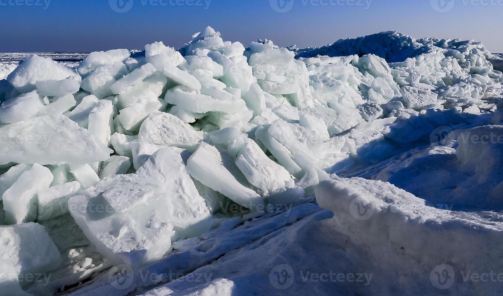 Ice Climatic collapse, heaps of ice blocks on the piers and the shore. The Black Sea near Odessa is frozen photo
