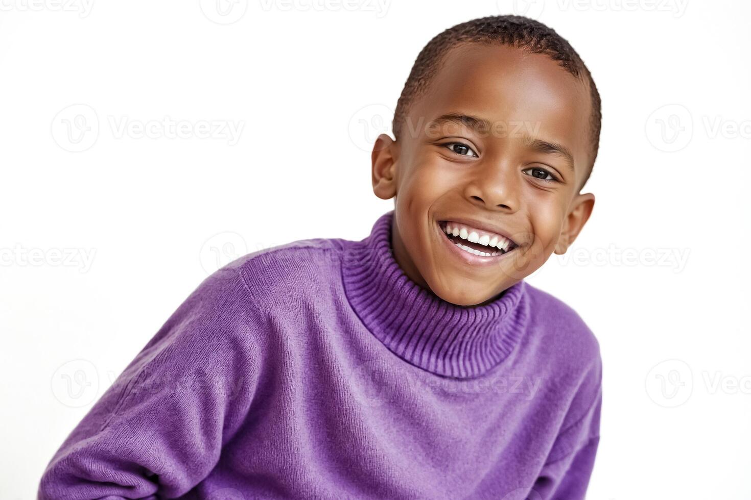 Happy young boy smiling at camera photo