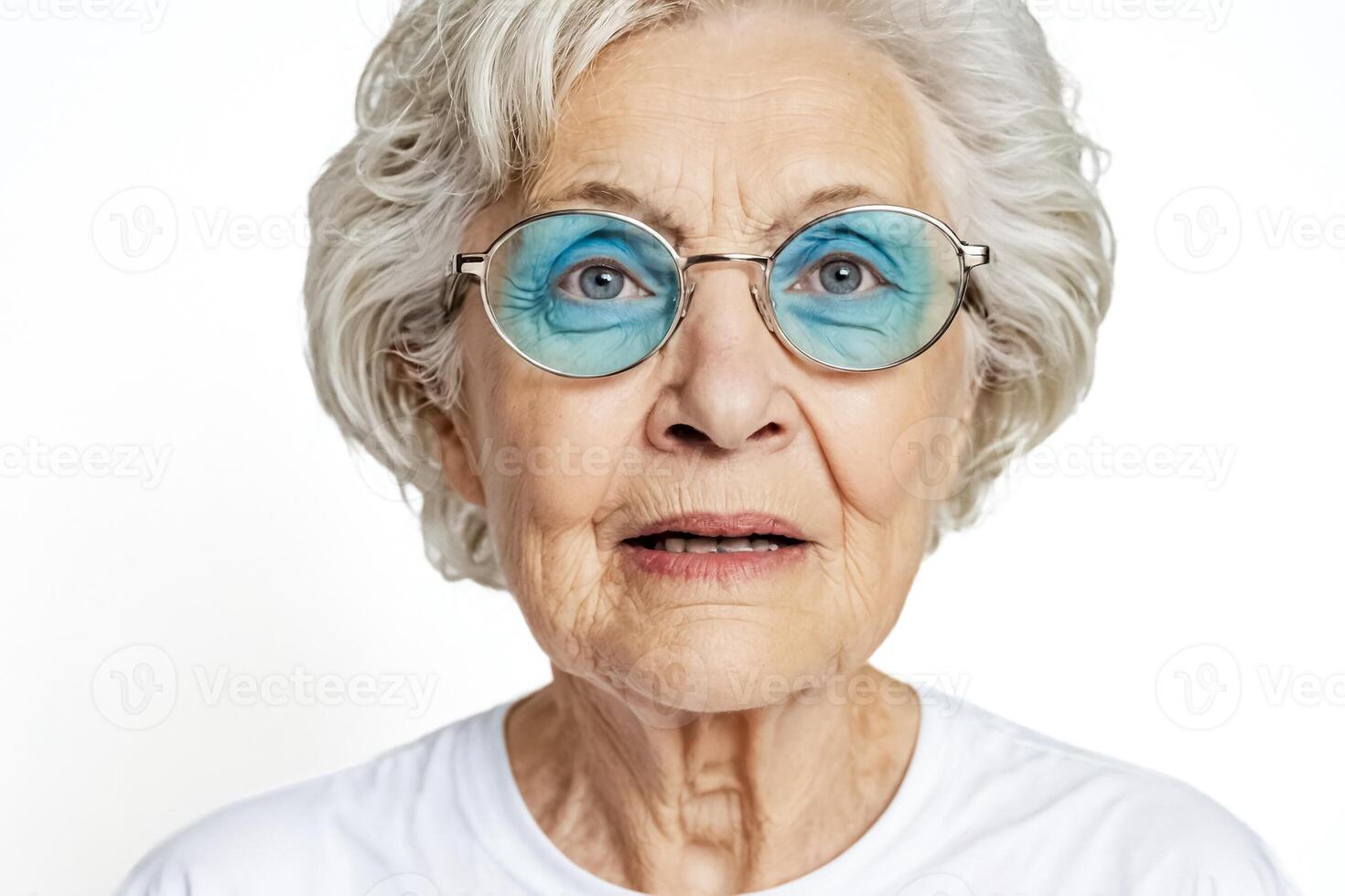 Portrait of a senior woman with glasses looking surprised photo