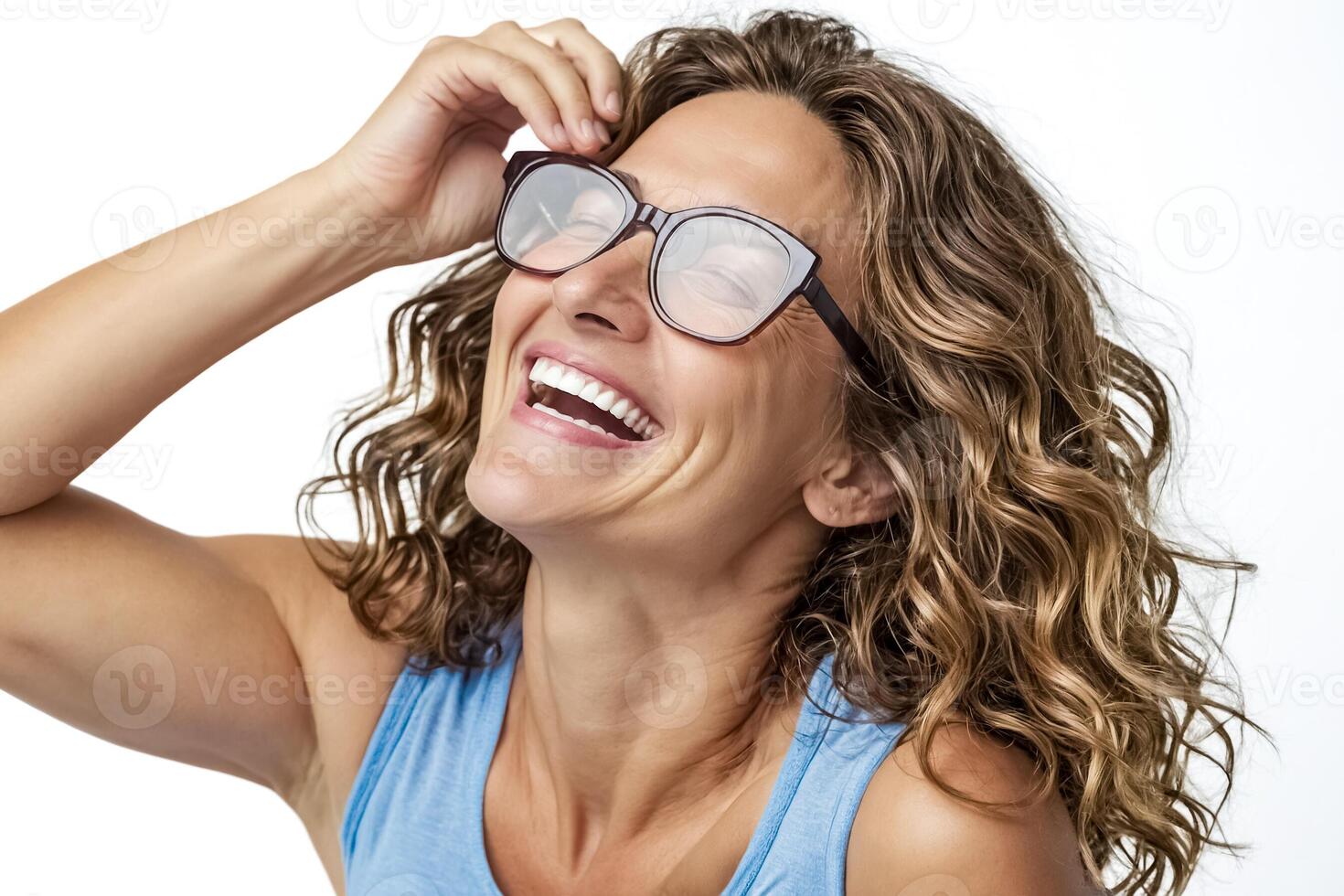 Happy woman wearing glasses and laughing photo