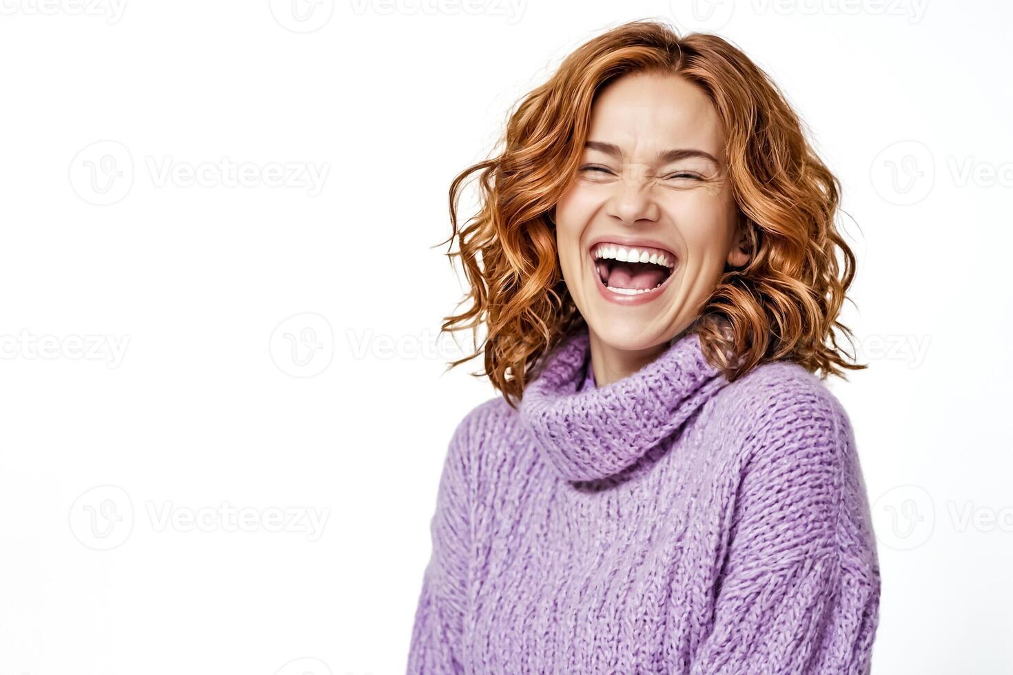 Portrait of a Happy Woman Laughing with Curly Red Hair photo
