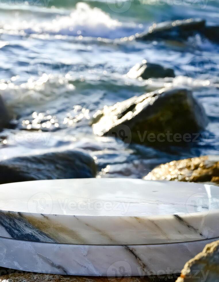 White Marble Pedestal on a Rocky Beach photo