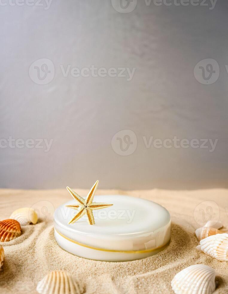 Seashells on a Sandy Background with a White Disk and Starfish photo