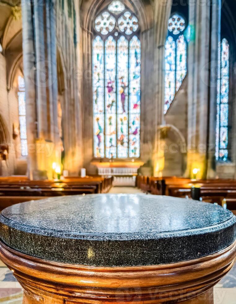 Stone baptismal font in church interior photo