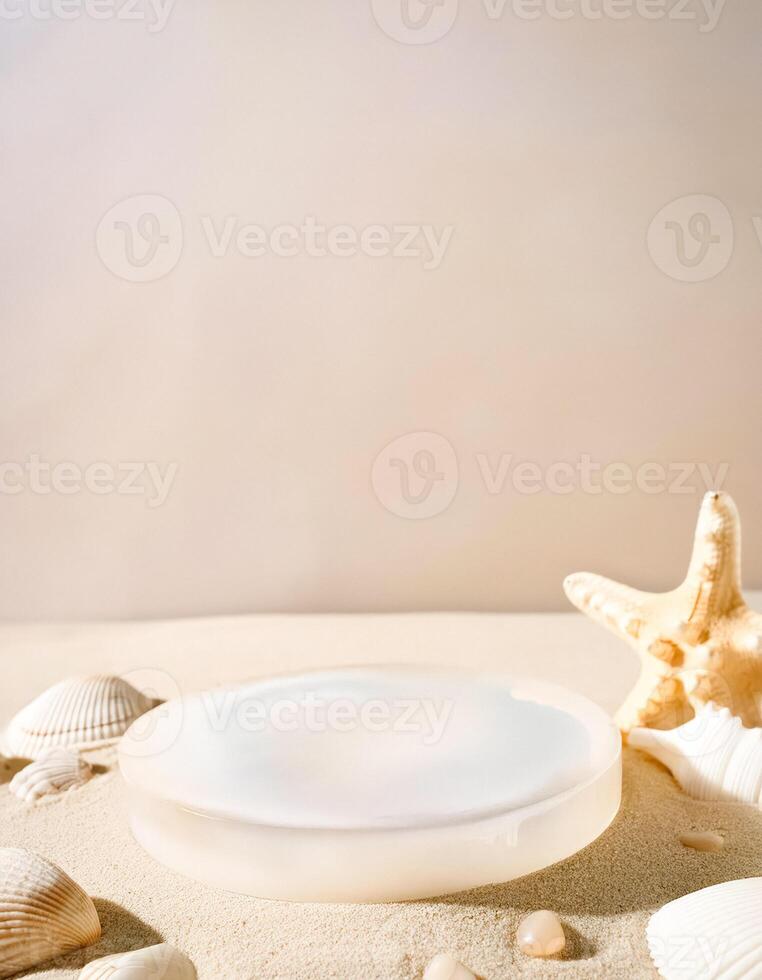 White podium with seashells and starfish on beige background photo