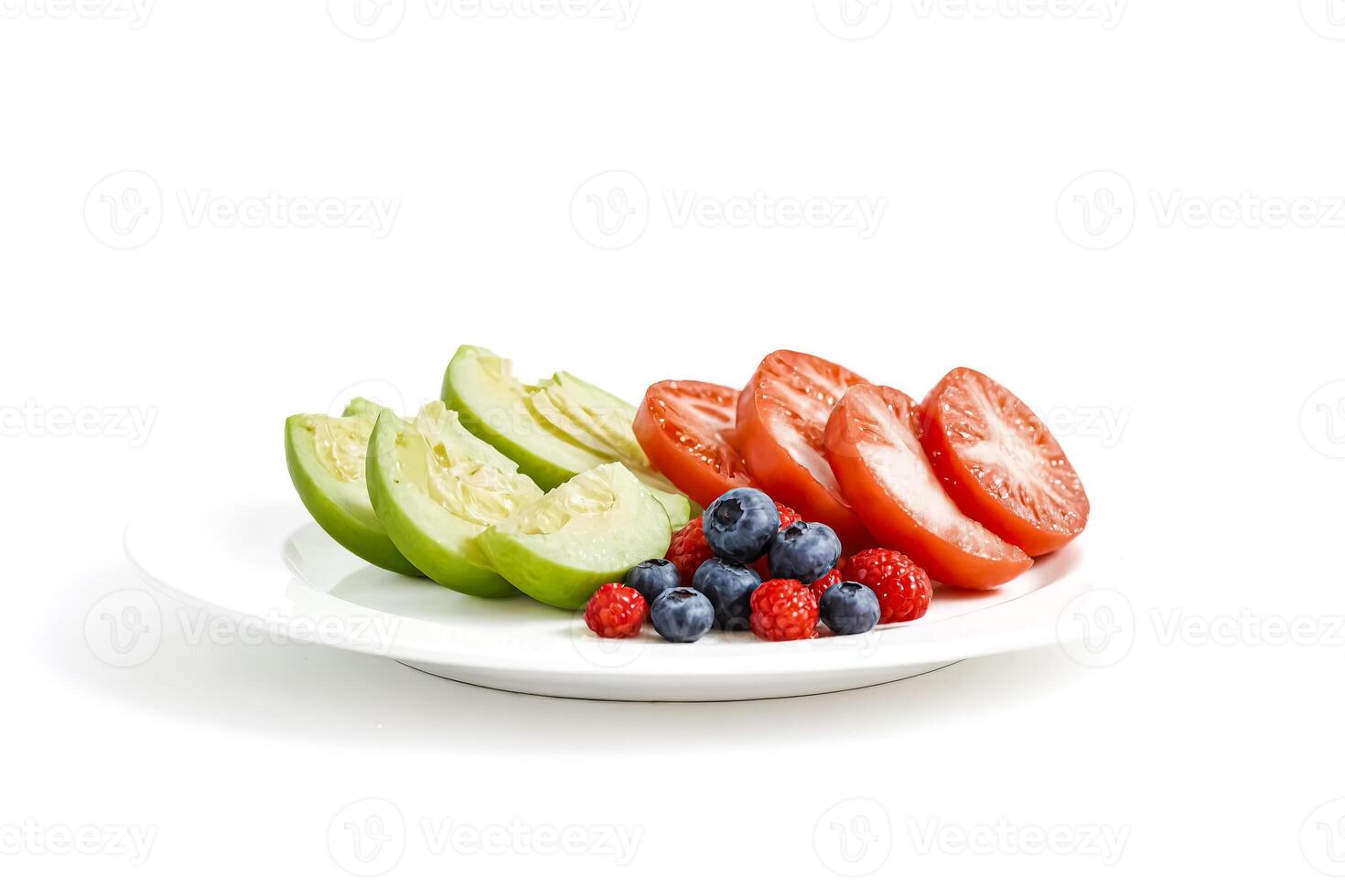 Close-up of melon slices, tomatoes, blueberries and raspberries on white plate photo