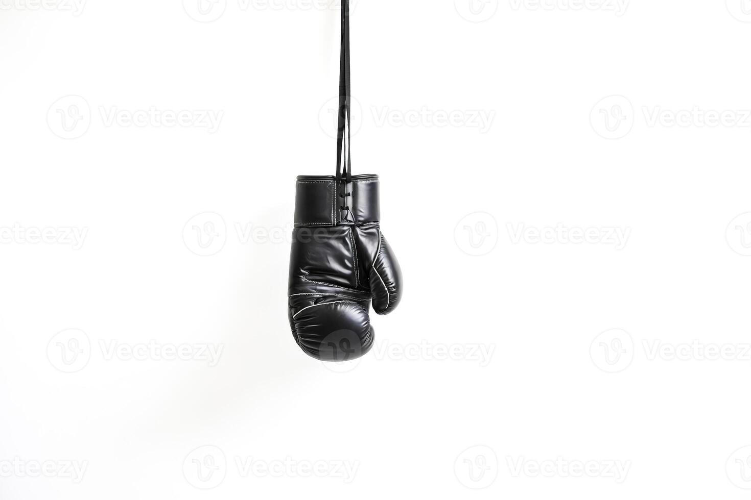 Black Boxing Glove Hanging Isolated On White Background photo