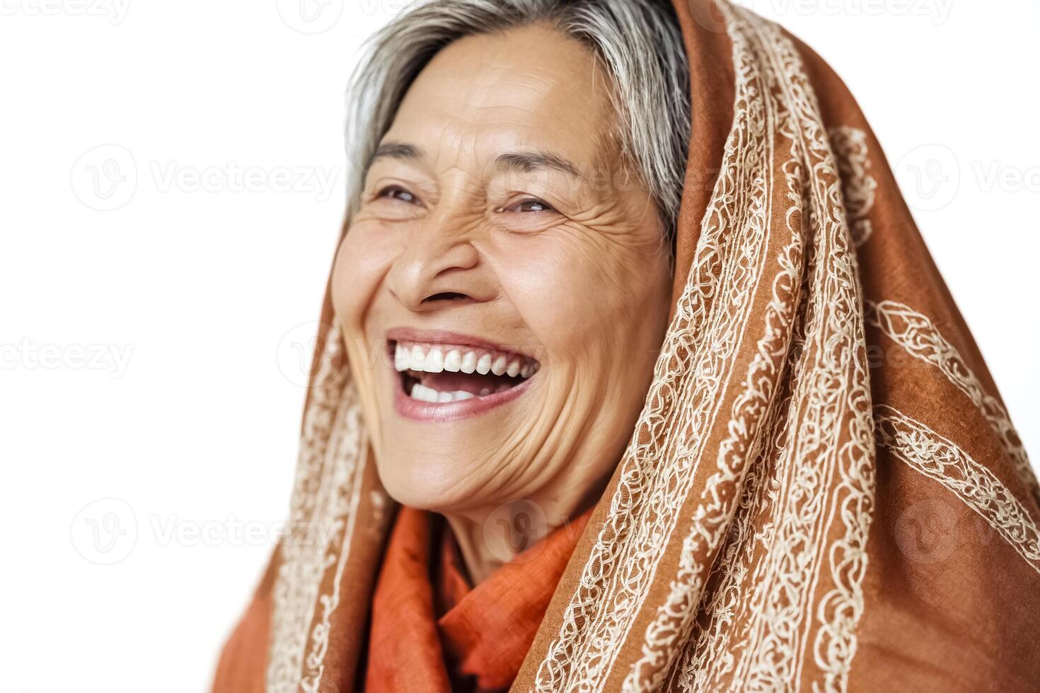 Happy senior woman wearing a brown shawl photo