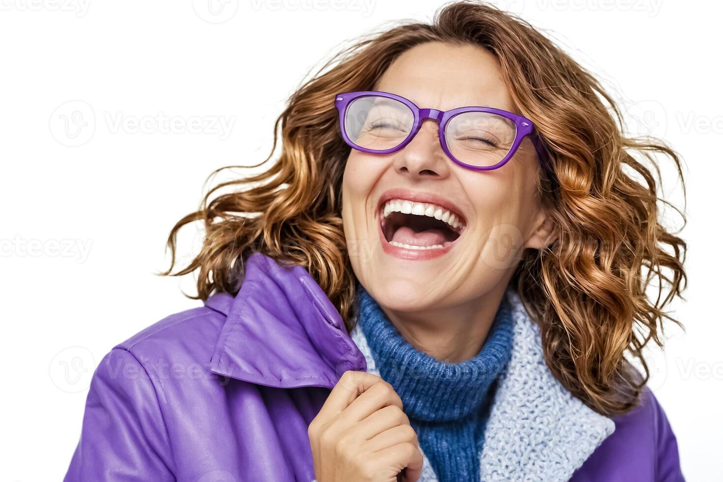 Portrait of a woman laughing in a purple jacket photo