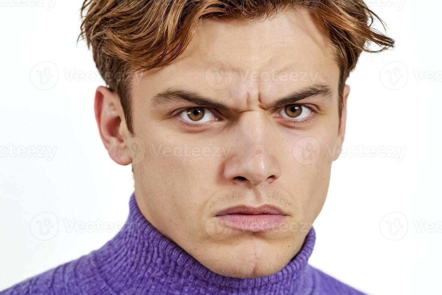 Close-up Portrait of a Young Man with a Serious Expression photo