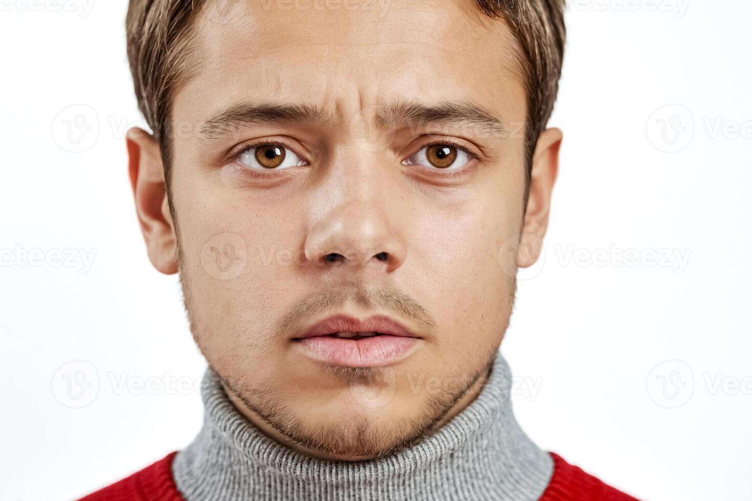 Close Up Portrait Of A Young Man With A Serious Expression photo