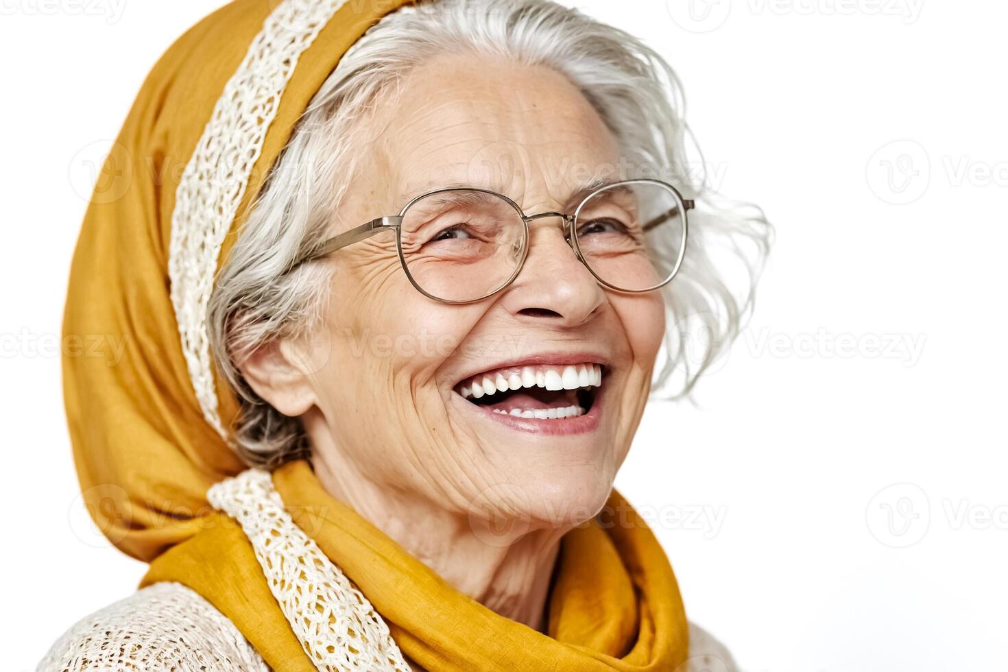Senior woman in yellow scarf laughs sincerely at the camera photo