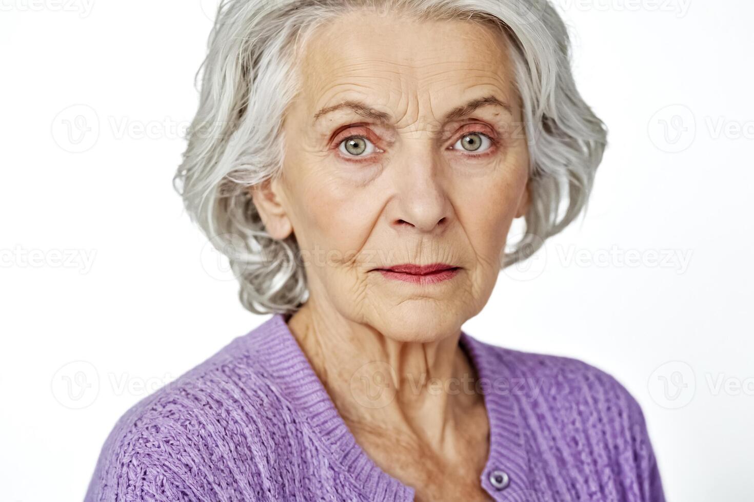 Close-up portrait of a thoughtful senior woman photo