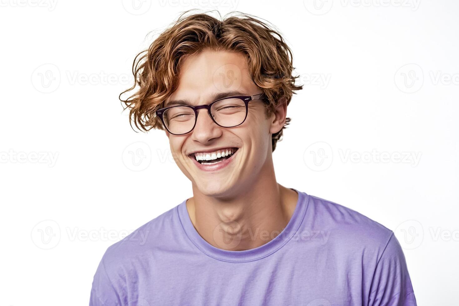 Happy young man with glasses laughing photo