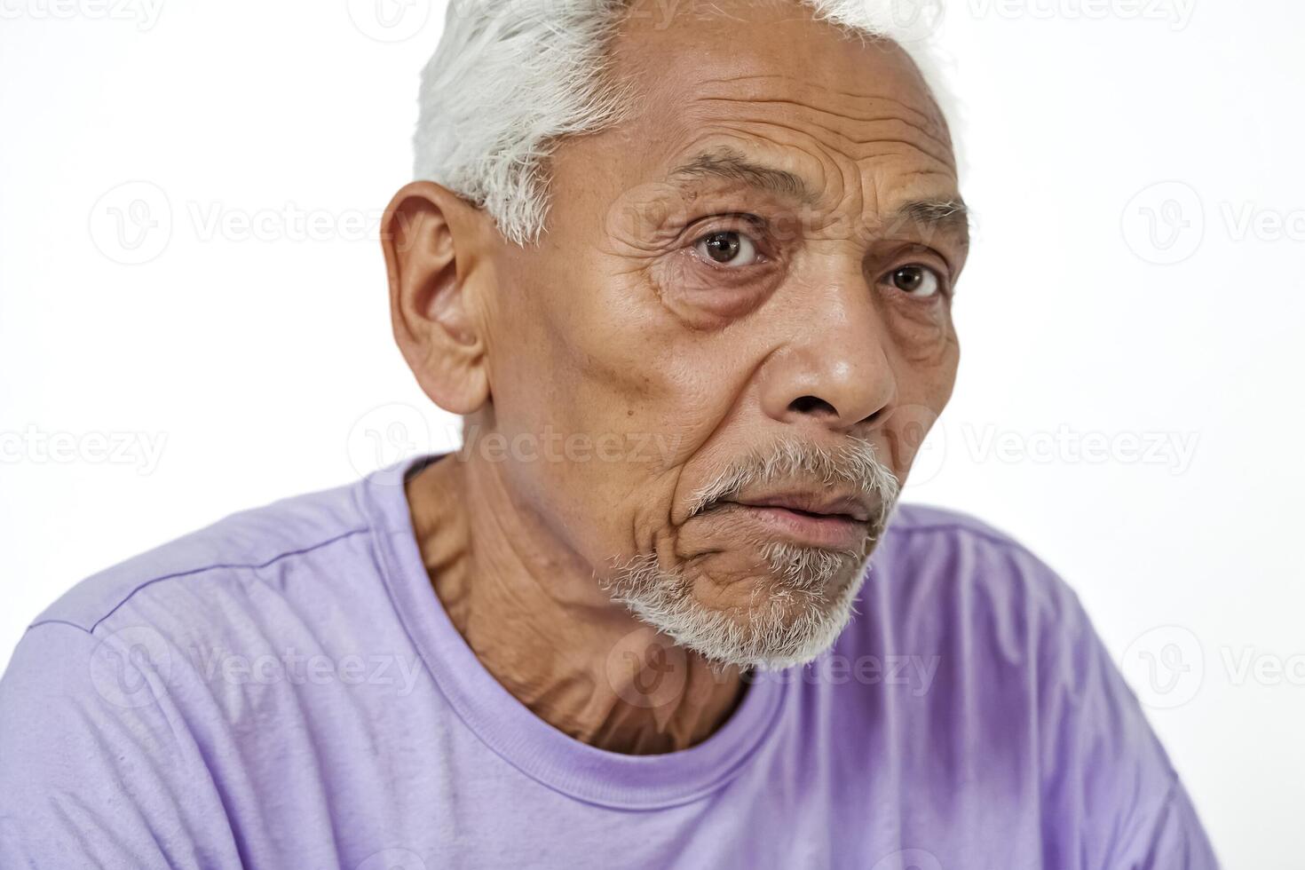 Portrait of a Senior Man with a White Beard and Wrinkles photo