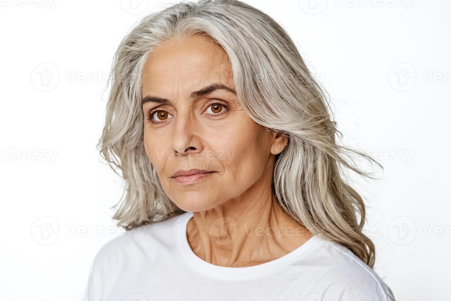 Mature woman with grey hair looking at camera photo
