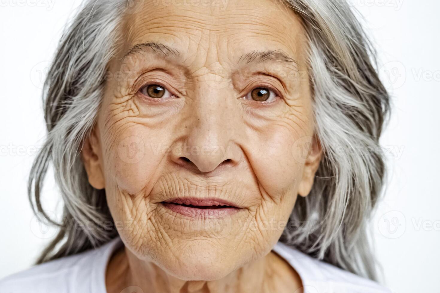 Close-up portrait of an elderly woman with grey hair photo