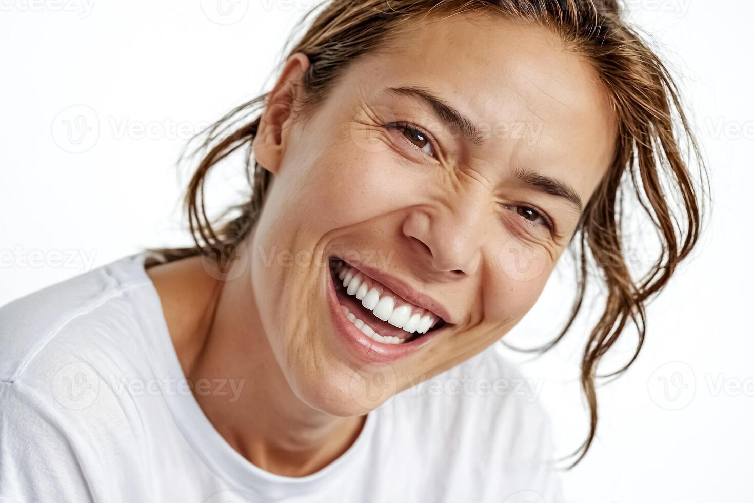 Close Up of a Woman Laughing with White Teeth photo