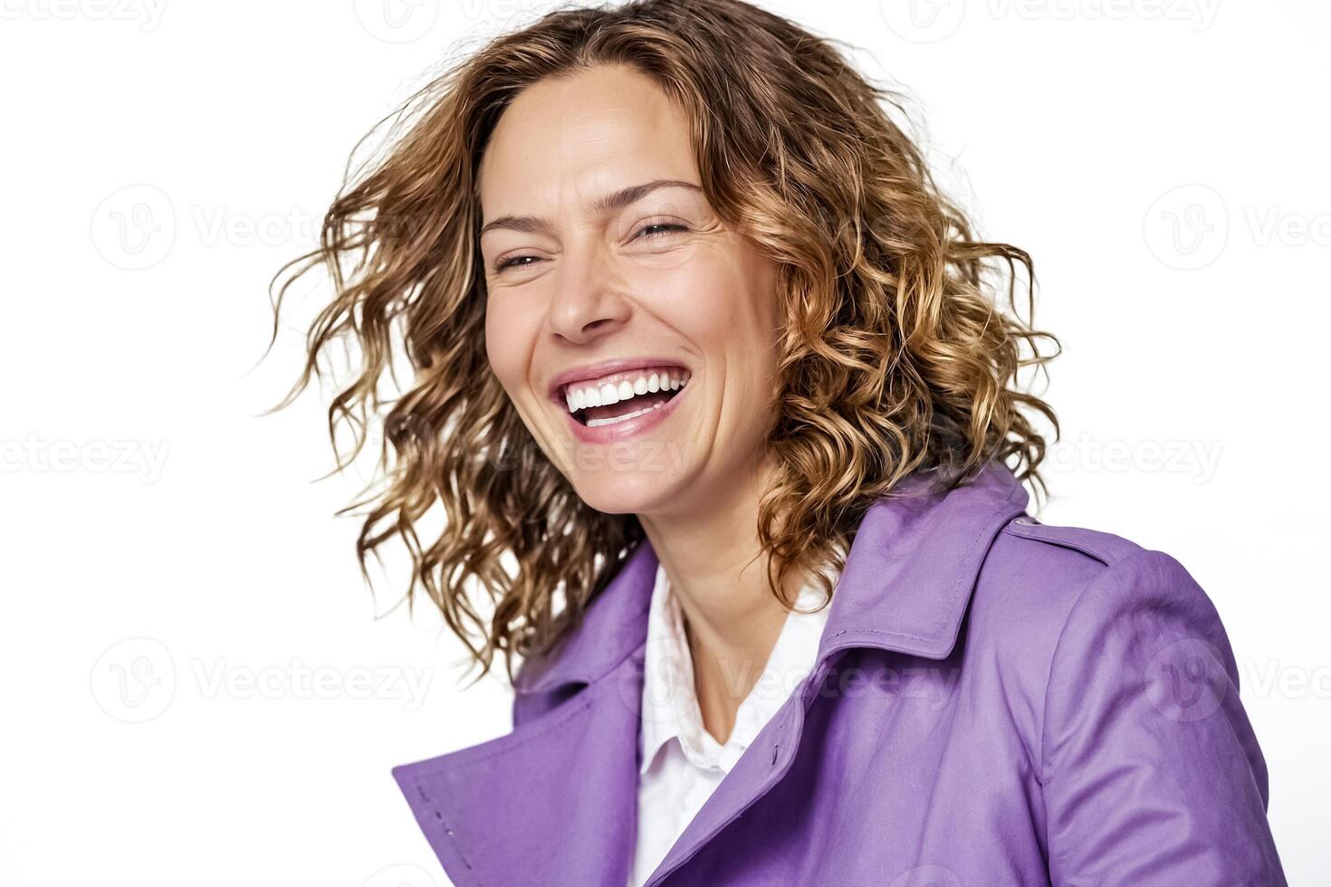 Portrait of a smiling woman with curly hair wearing a purple jacket photo