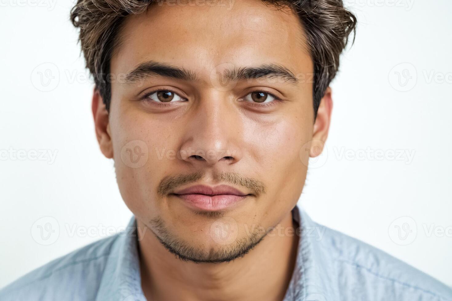 Close-up Portrait of a Young Man with a Serious Expression photo