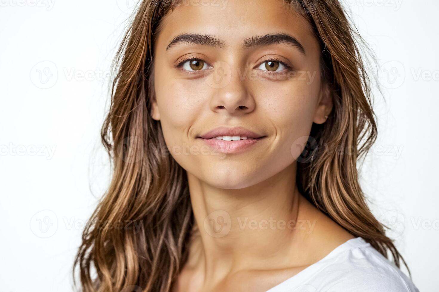Portrait of a beautiful young woman with brown hair and brown eyes photo