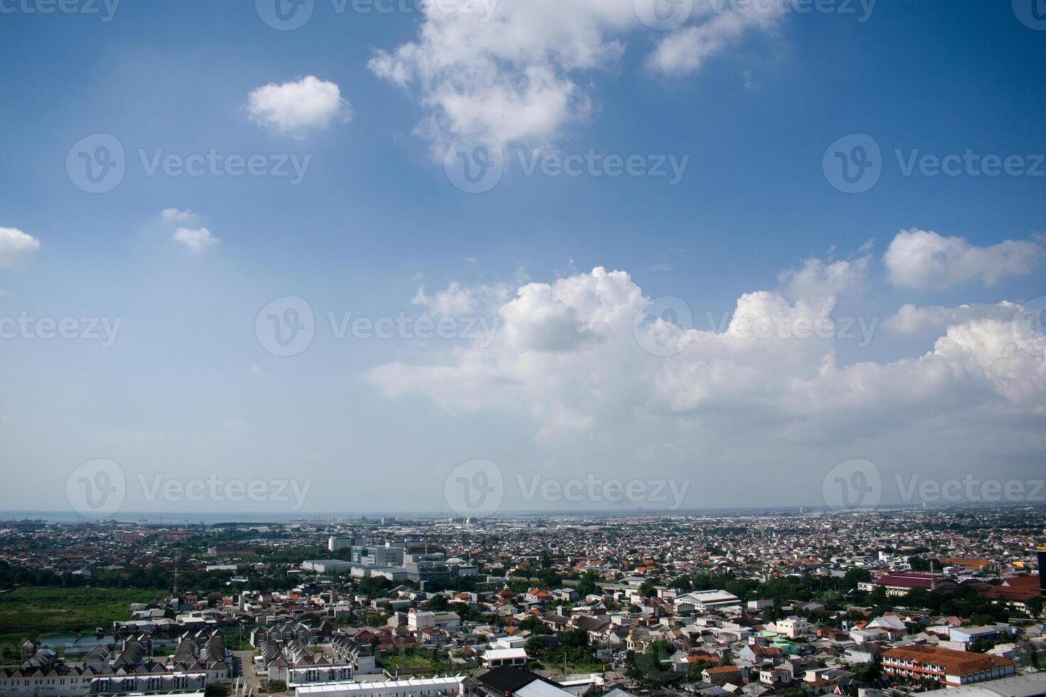 High angle aerial Settlement semarang Indonesia with cloudy blue sky background photo