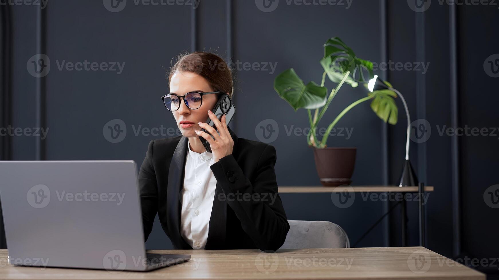 Middle-aged Business woman working in office with documents and laptop people. Consulting and business planning. Creative startup, digital tech for research, website and discussion. photo