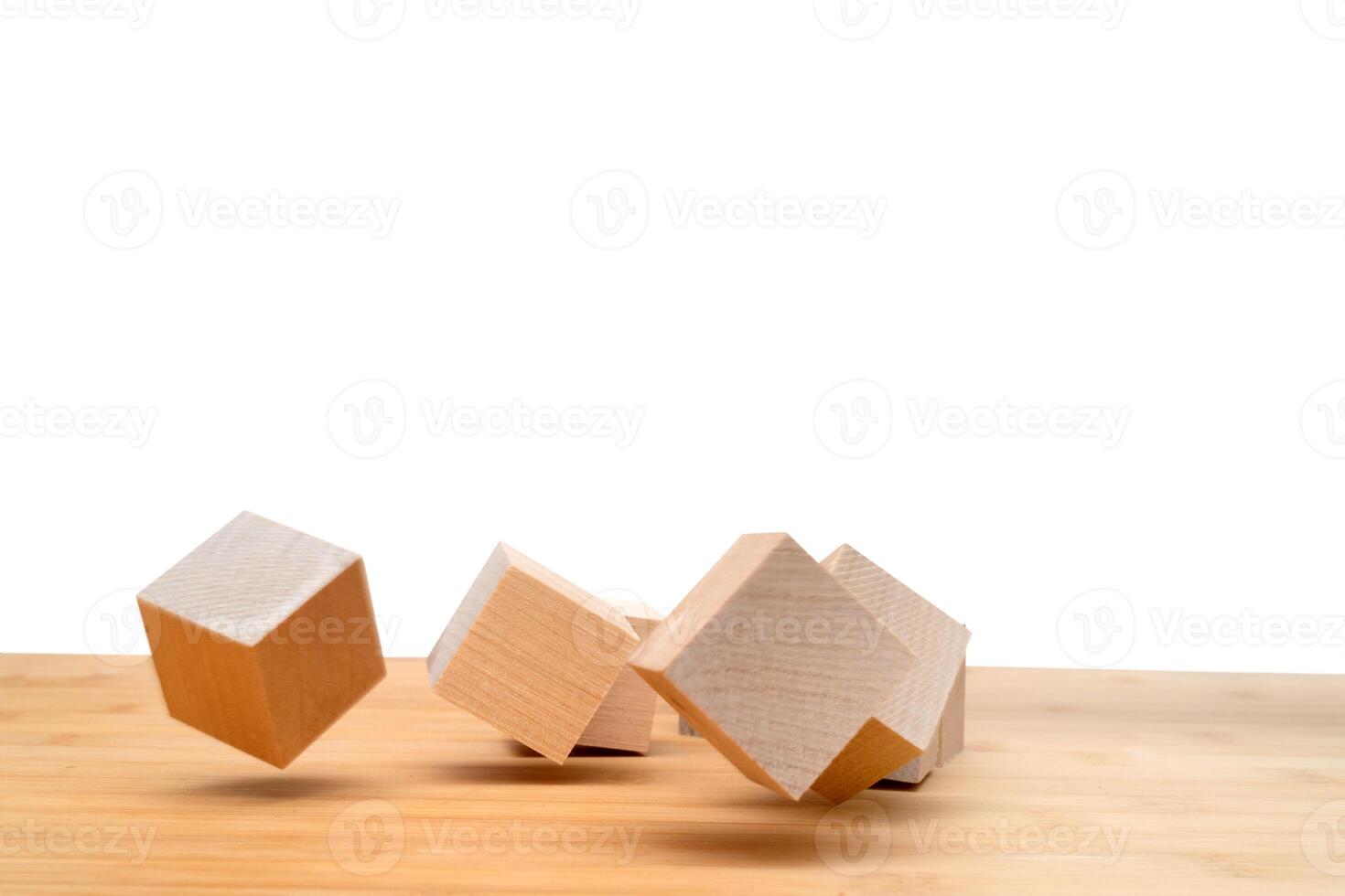 Wooden cubes roll on an inclined plane. photo