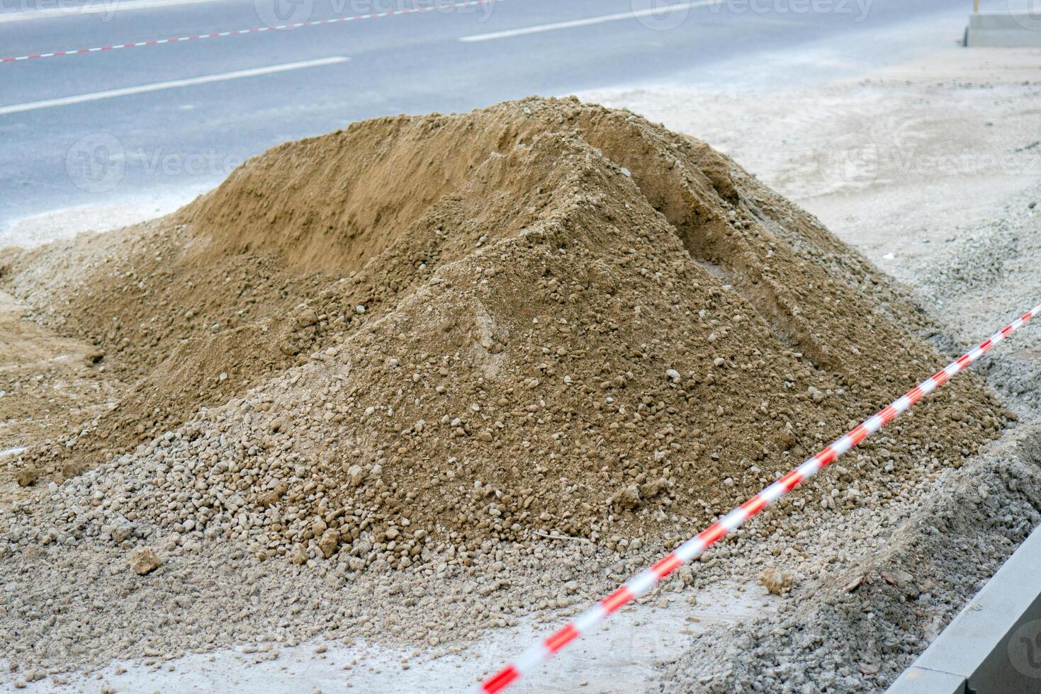 A pile of gray gravel. Repair of roads in the city. photo