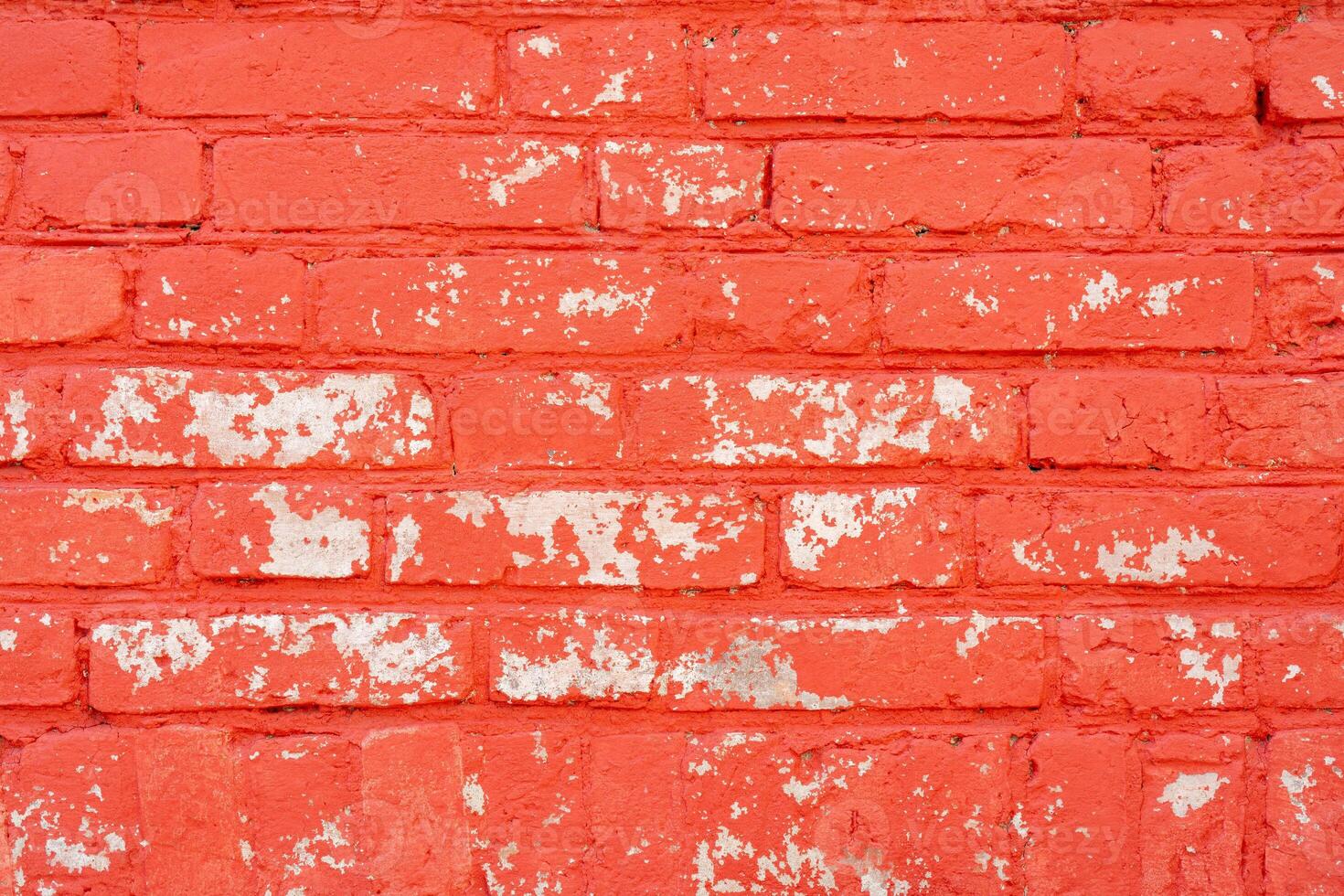 The brick wall is painted red. Abstract architectural background. photo