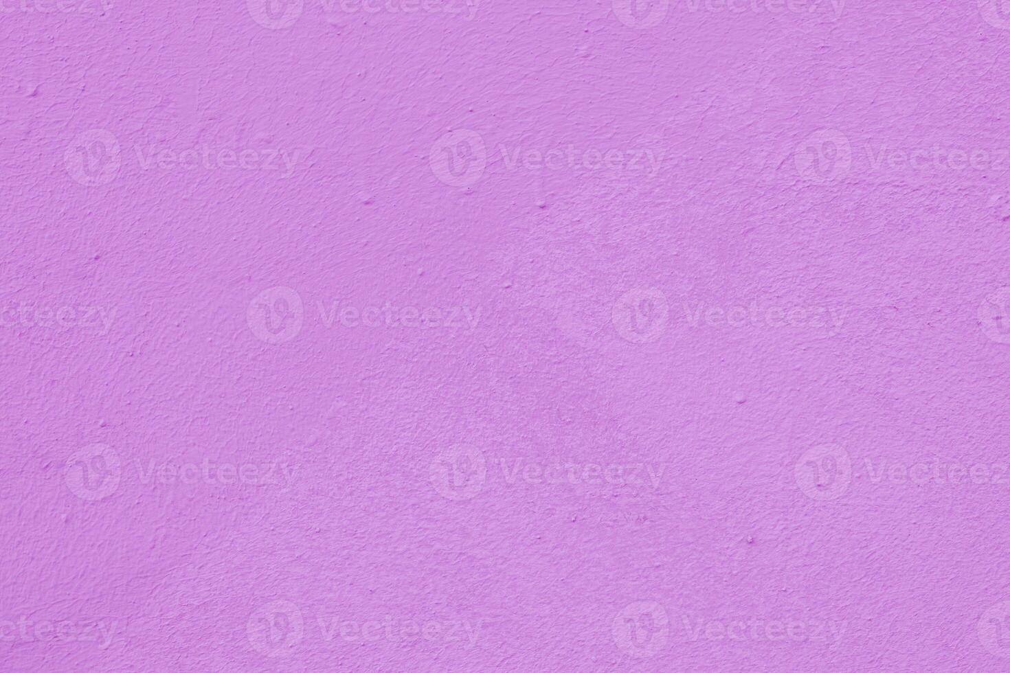 Pink wall of the building. Rough plaster surface. Abstract background. photo