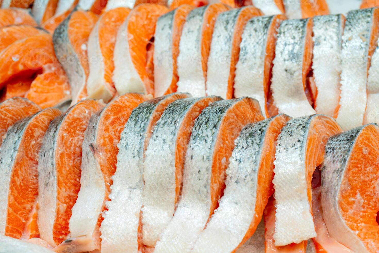 Salmon steak on counter ice in a supermarket. photo
